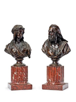 pair of bronze busts of a man and a woman on marble bases