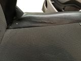 a car seat with a seat belt that has a hole in it