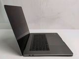 a laptop that is sitting on a white table