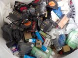 a white trash can filled with assorted items