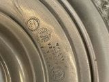 a close up of a silver plate on a table
