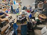 a lot of clutter in a room with a lot of boxes