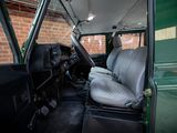 an image of a green van with a seat up