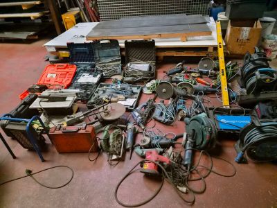 a lot of tools on the floor in a room