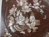 a wooden box with a picture of a man and a woman on it