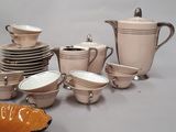 many different types of dishes and cups on the table