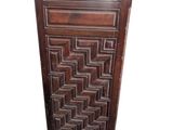 an image of a tall wooden cabinet with a geometric design