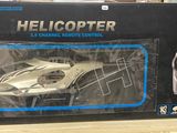 a box with a remote control and a model of a car