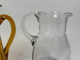 two vases sitting next to each other on a table