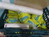a basket full of toilet paper and other items