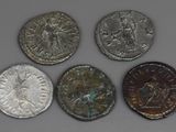 six ancient roman coins from the time of the roman empire