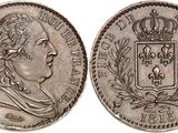 a silver coin with a crown on top of it