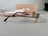 glasses are sitting on a table next to a pink case