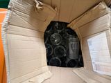 a cardboard box with a bunch of empty bottles inside of it
