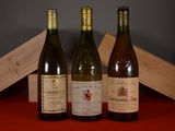 three bottles of wine sitting next to each other on a table