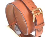 leather bracelet with a gold buckle on a white background