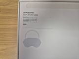packaging of an airpods max with small case on a wooden table