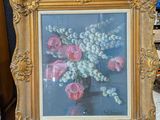 une photo d'un tableau représentant des fleurs dans un vase posé sur un chevalet