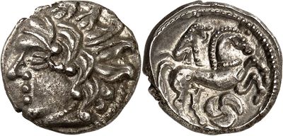 a silver coin with an image of a horse on it