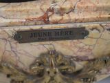 a marble vase with a plaque on it that says jeune merre