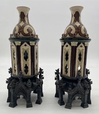 two vases sitting on top of each other on a table
