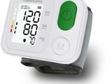 a digital wrist blood pressure monitor on a white surface