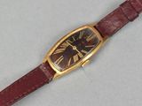 an image of a wrist watch with roman numerals on the face