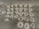 many empty wine glasses sitting on a table