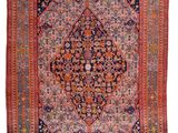 tapis persan antique à motif de médaillon sur fond rouge