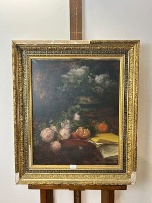 a picture of a painting on a easel with a painting of fruit and vegetables on it