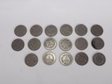 several coins are arranged in a circle on a white surface