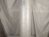 a large roll of white tissue on a white sheet