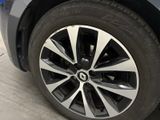 a close up of a car ' s wheel on the street