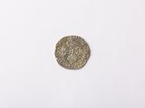 an old coin on a white surface with a white background