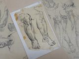 several drawings of a man ' s legs and feet are shown on a table
