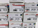 boxes of mail are stacked on top of each other on a white surface