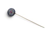 a close up of a metal stick with a pink stone on it
