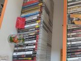many dvds stacked on the shelves in the room