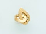 an image of a gold ring on a white surface