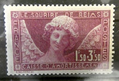 un vieux timbre sur lequel figure l'image d'un ange