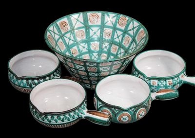 five bowls and a bowl on a black background