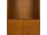 a wooden bookcase with two doors and two drawers