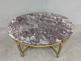 an image of a marble top coffee table with gold legs