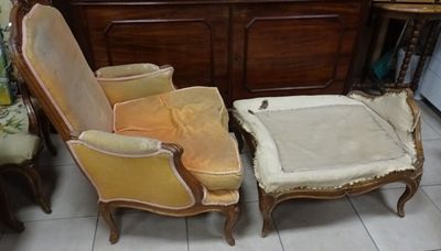 two chairs and a foot stool in a room