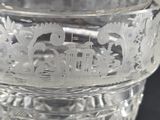 a clear glass bowl with a design on it