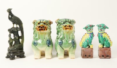 three figurines of dogs sitting next to each other