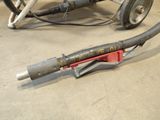 a hose attached to the side of a cart