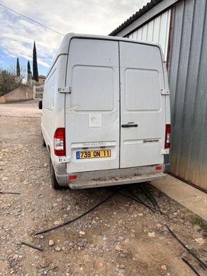 a white van that is parked in front of a building