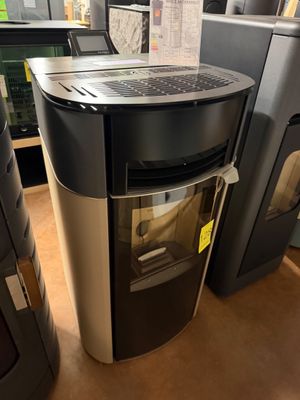 a refrigerator with a computer on top of it in a store