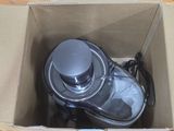 a box with a blender inside of it on a table